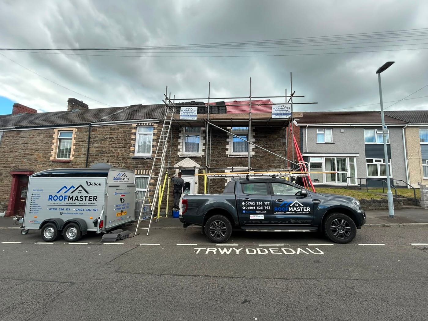 The Roofmaster van and trailer on a re-roofing job at a Swansea terraced house