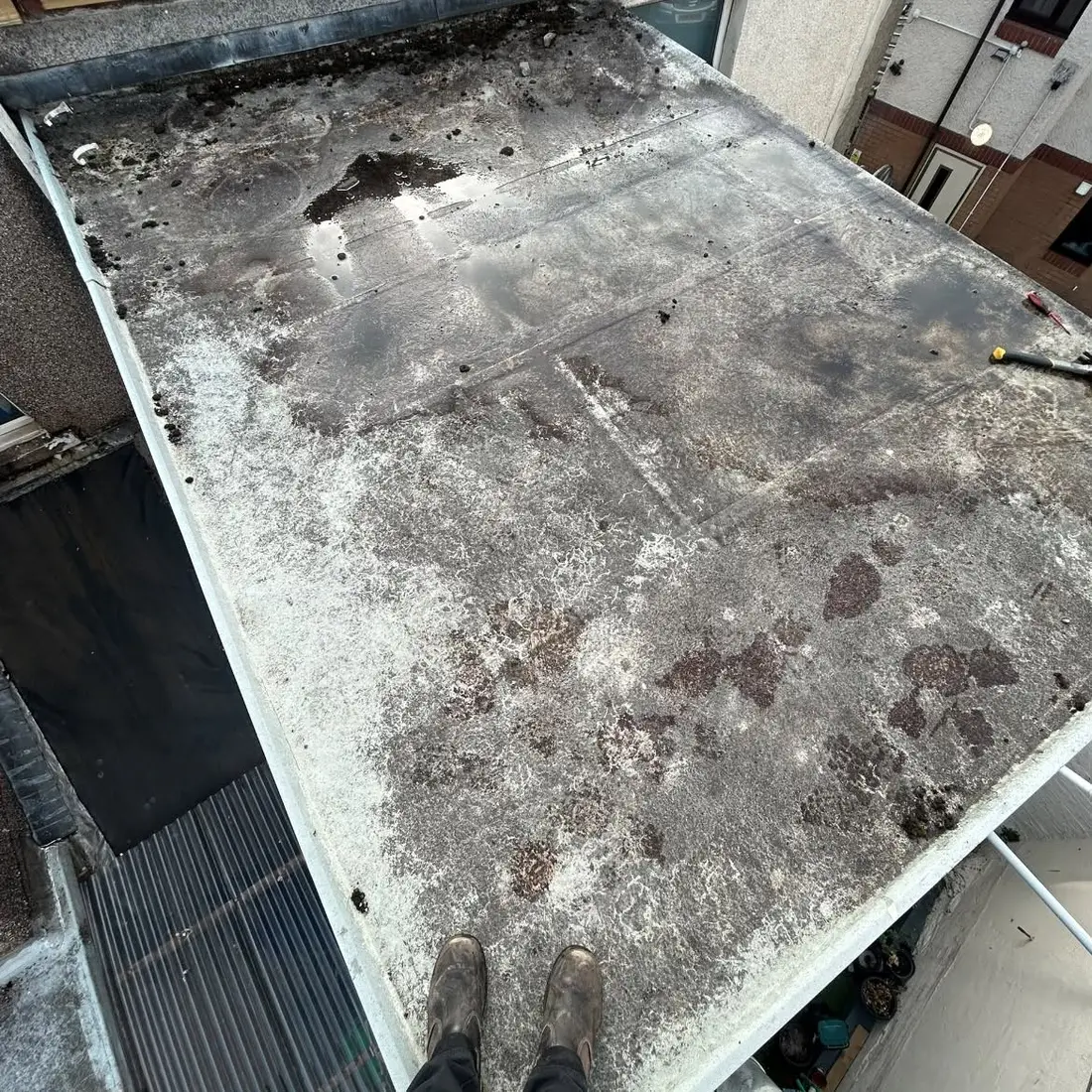 Before: A failed felt flat roof stripped off and re-covered